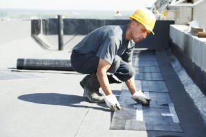 Roofer working on a commercial or industrial building